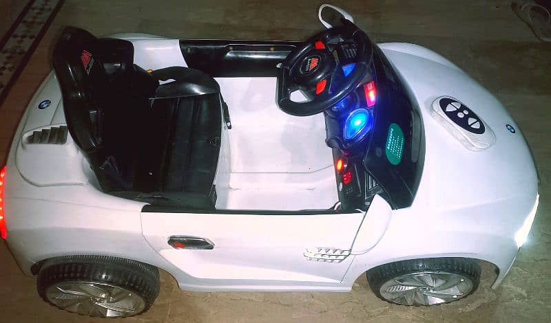 BMW Kids car with remotecontrol & swing function/Lights, music, All ok 9