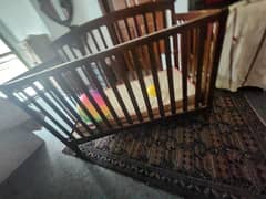 baby Cot, brown colour. good condition with mattress