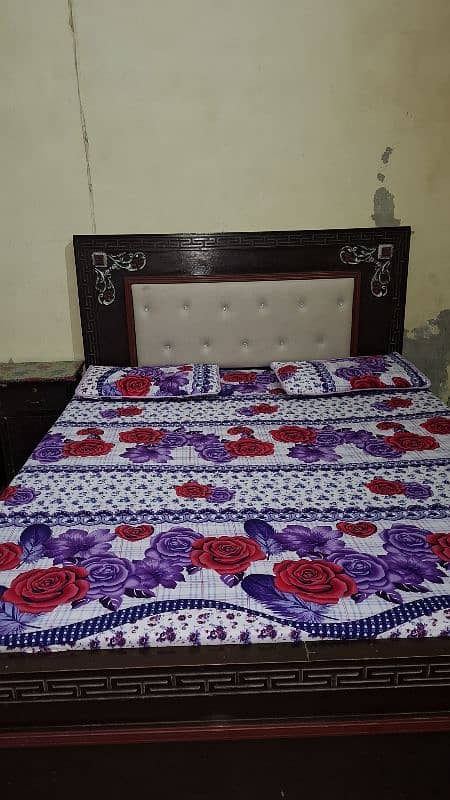 beautiful wooden bed with side table and dressing 0