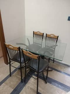 medium size 4 chairs and 1 glass top table