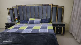 Elegant and cushioned Bed with sidetables and full storage dressing