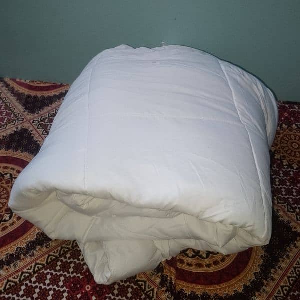 white blanket (bed comforter( 2