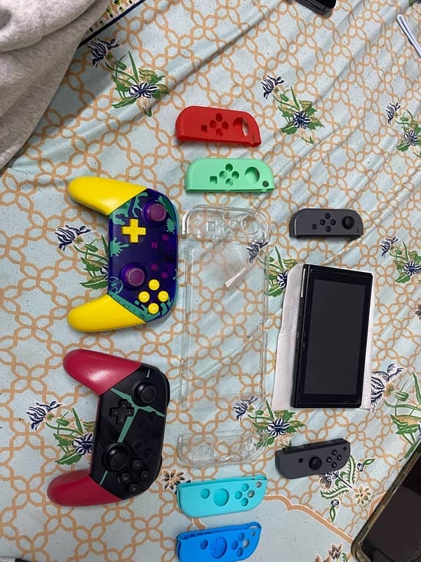 Nintendo Switch (v2) second gen with PRO Controllers 6