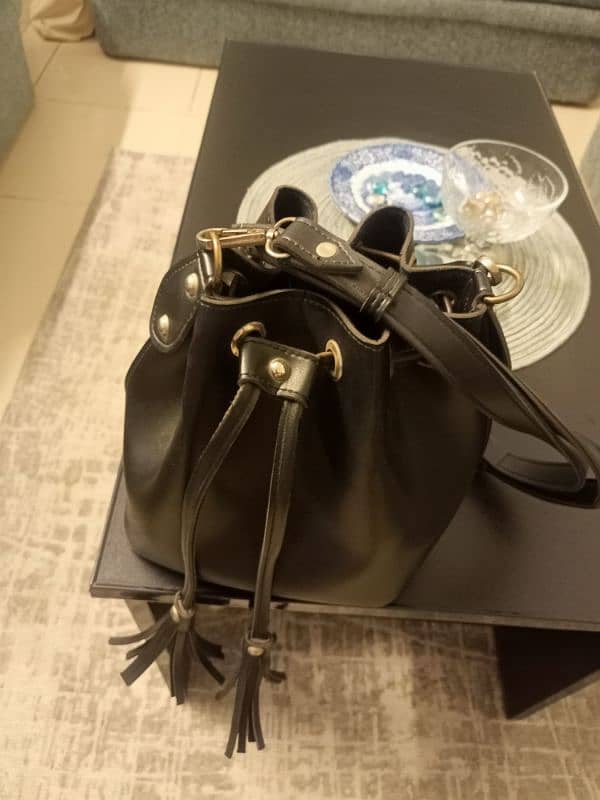 black colour handbag 0