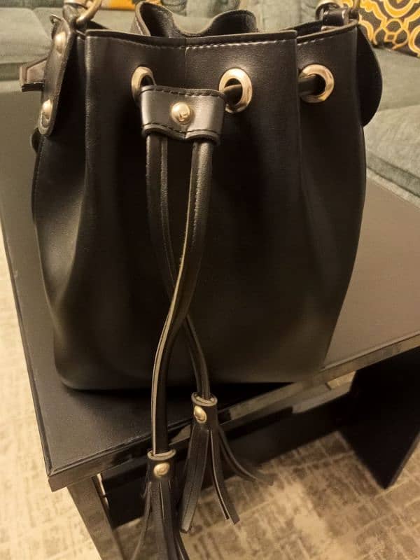 black colour handbag 5