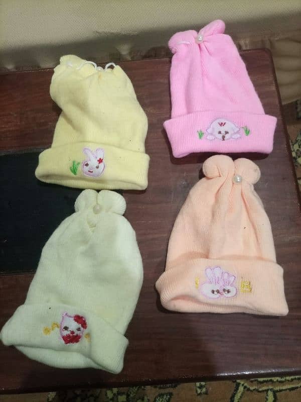 new born baby warm winter caps in good condition 0