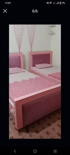 almost new 2 single deco painted beds with 2 side tables.