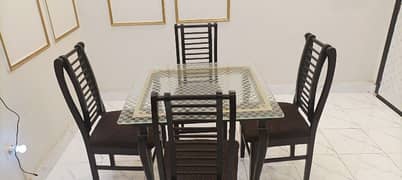 glass table with four chairs