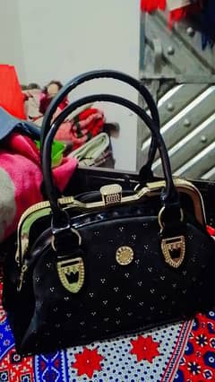 A black colored hand bag for sell.