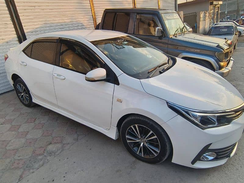 White Toyota Corolla Altis 2