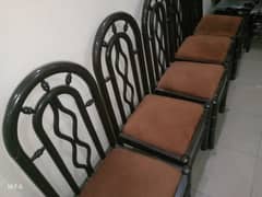 five wooden chairs.