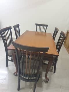 Well preserved dining table with 6 chairs