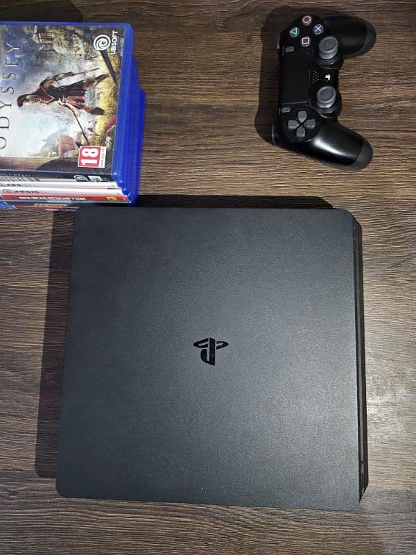 PS 4 slim with original controller and 7 games 0