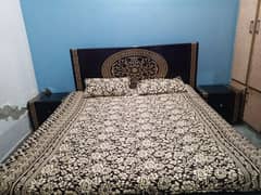 black bed with dressing