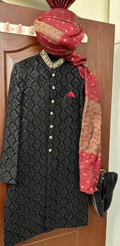 groom sherwani with qulla and shoes