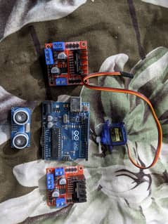 Arduino UNO kit + ultrasonic sensor module + motor driver kit + others