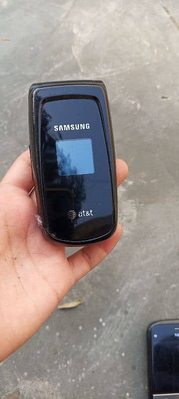 Samsung A117 flipping mobile 0