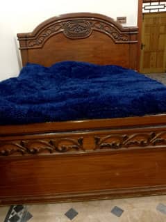 wooden double bed without mattress