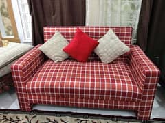 2 seater sofa in red & white color without cushions