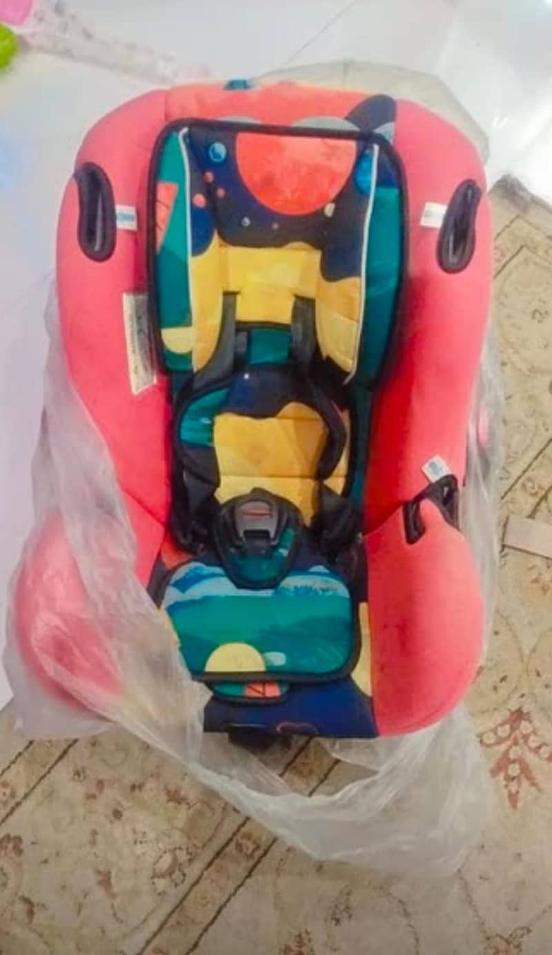 ALMOST NEW CARRY COT +  IMPORTED CAR SEAT AND BABY CHAIR 1