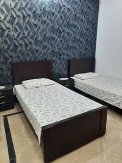 2 Single beds 2 Side tables with 5 inches Matresses