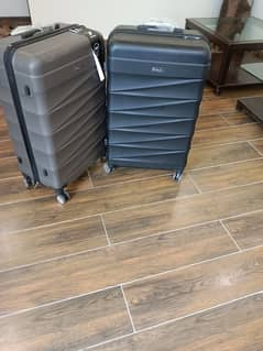 2 black and brown pigeon luggage bags for sale 9 k each