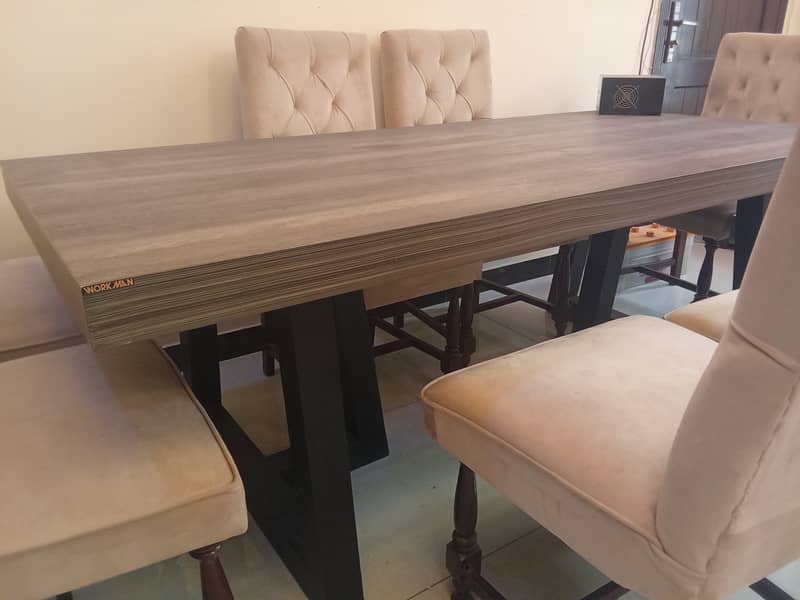 Wooden branded 8 seater dining table (workman) and 8 chairs 7