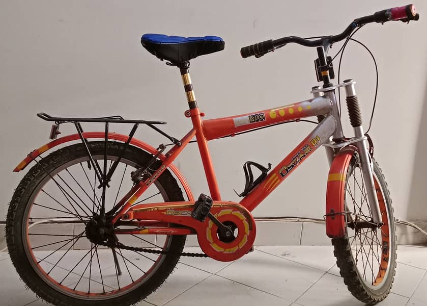 Bicycle in orange color | Stylish and Durable Bike for All Ages" 2