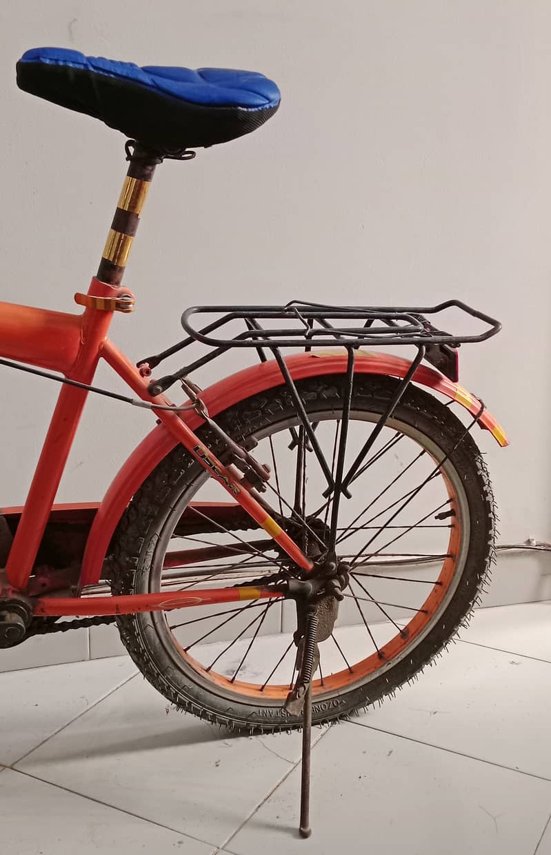 Bicycle in orange color | Stylish and Durable Bike for All Ages" 5