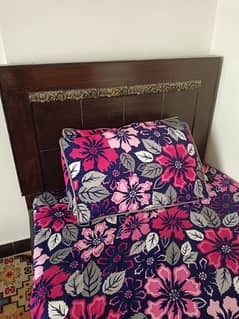 single wooden bed  with mattress also