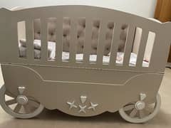 baby wooden cot in deco paint