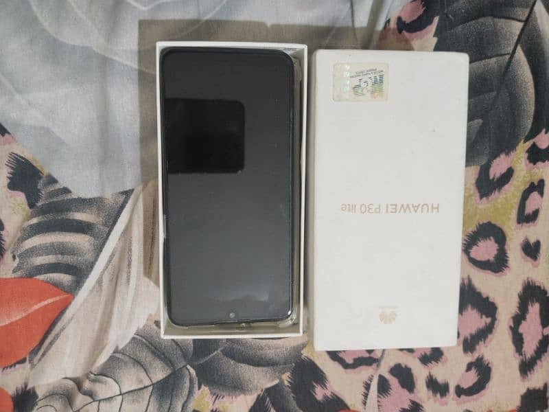 selling my Huawei p30 lite 4gb ram 128 battery replaced 7