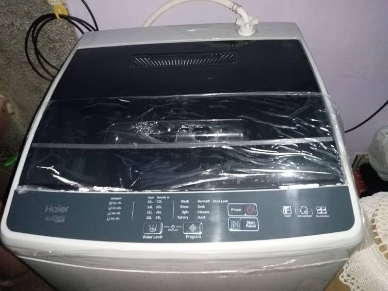 Haier automatic machine bilkul new ha 10/10 condition ha 8kg 1