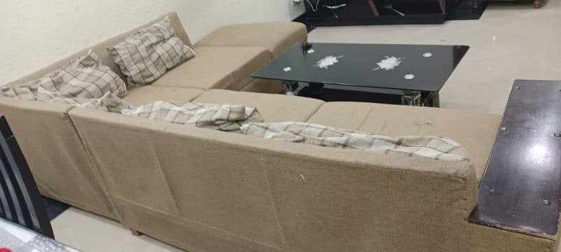 L shape sofa with table and cushions  for urgent sale 1