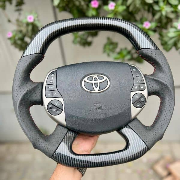 Toyota Prius + Aqua carbon fiber steering available 2