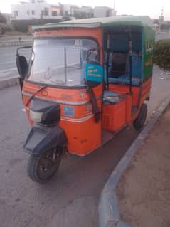 orange colour riksha genuine condition.