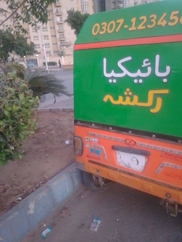 orange colour riksha genuine condition. 3