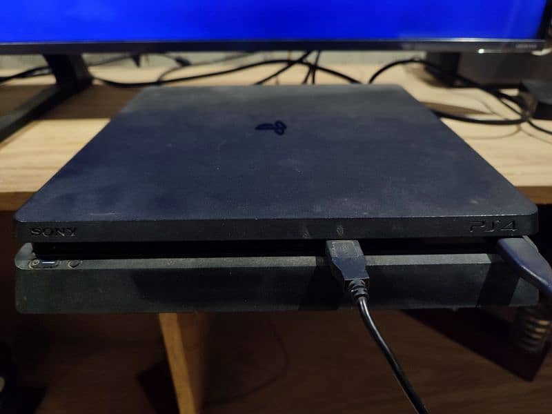 PS4 Slim (500GB) with 2 controllers and 7 Games 6