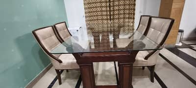 wooden dining table with chairs