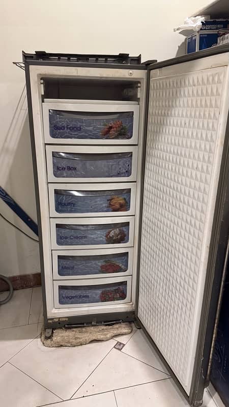 Dawlance freezer, vertical shape with multiple shelves . 1