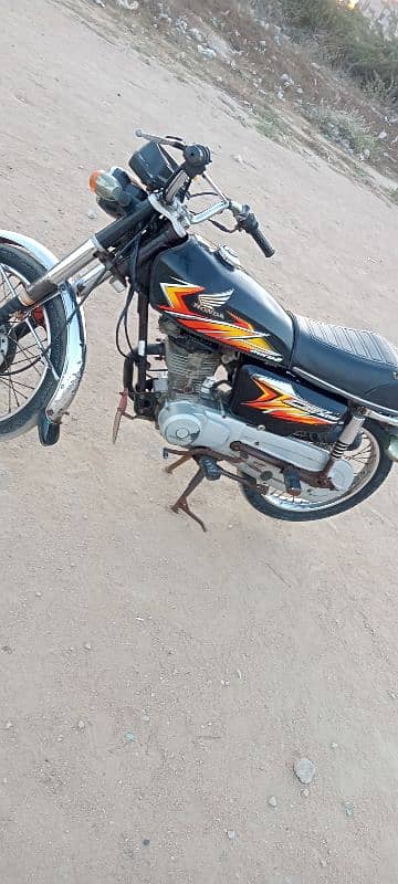 Honda 125 Karachi number first owner 0312/24/92/688 8