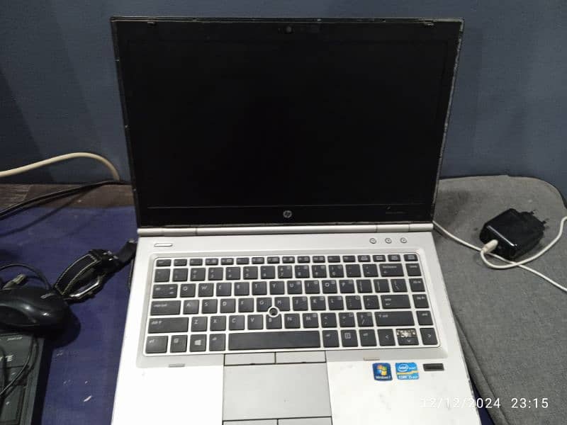 laptop ,adopter,LCD, and keyboard 3