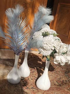 flowers with white vases