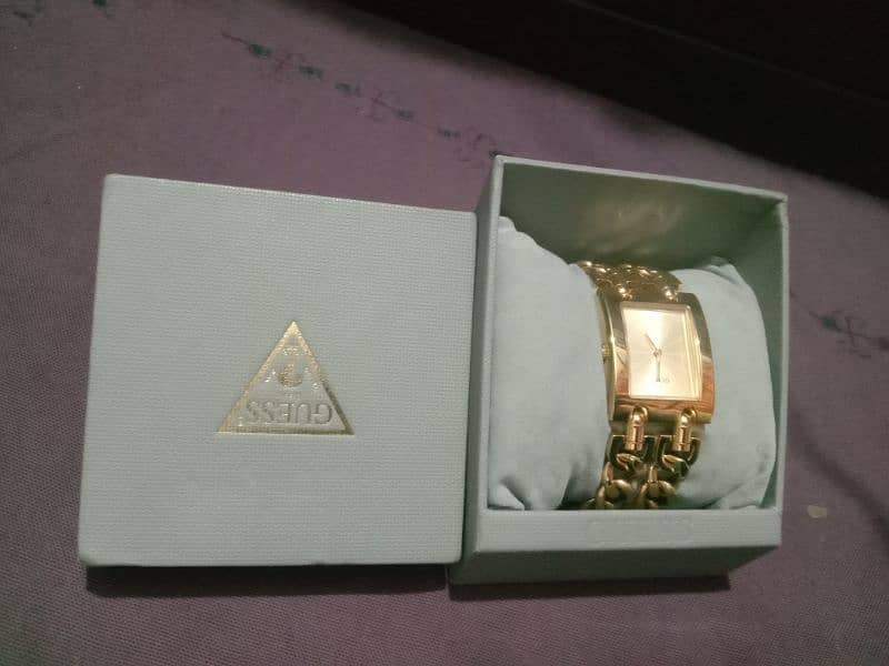 Guess Gold stainless brand 5