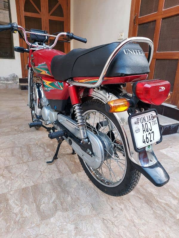 united 70 cc red bike 6