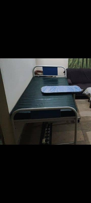 Rolling medical bed with Mattress and side table 0