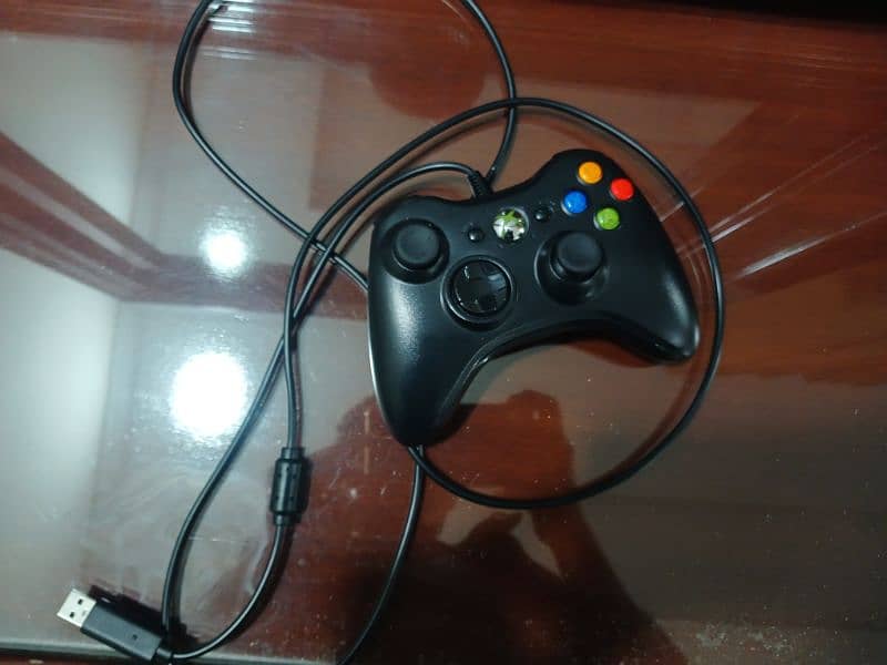 Xbox 360 slim in good condition with games downloaded 3