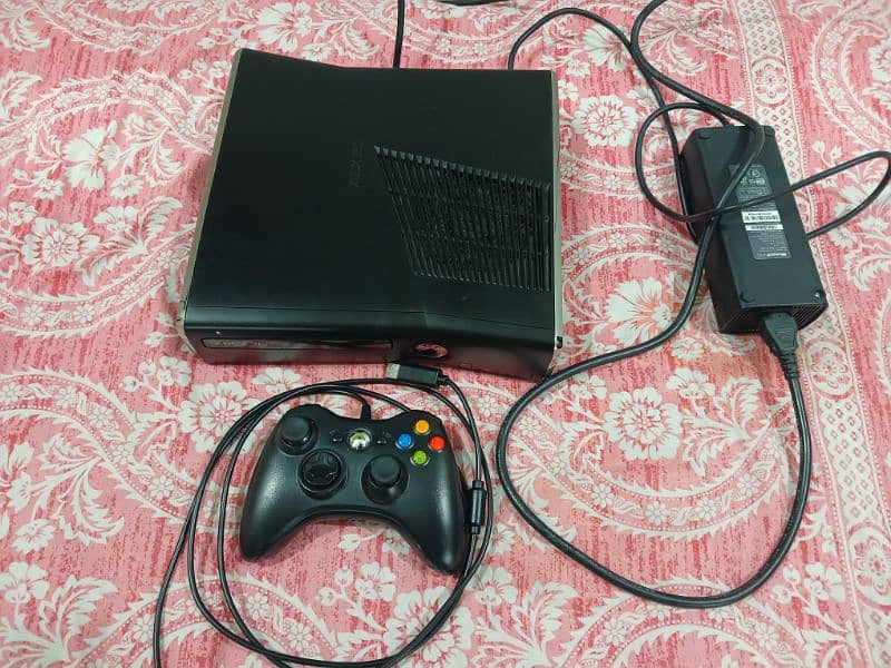 Xbox 360 slim in good condition with games downloaded 4