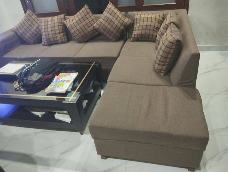 L shaped sofa for sale, good condition brown pattern color 0