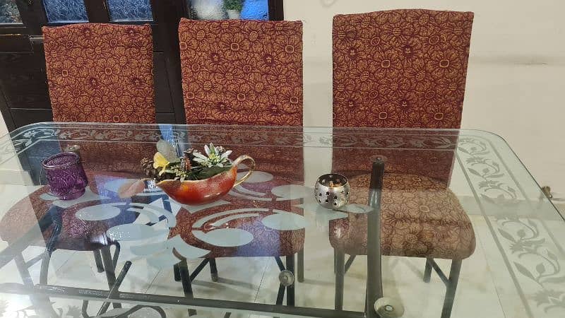 Glass dining table with six chairs for sale 1